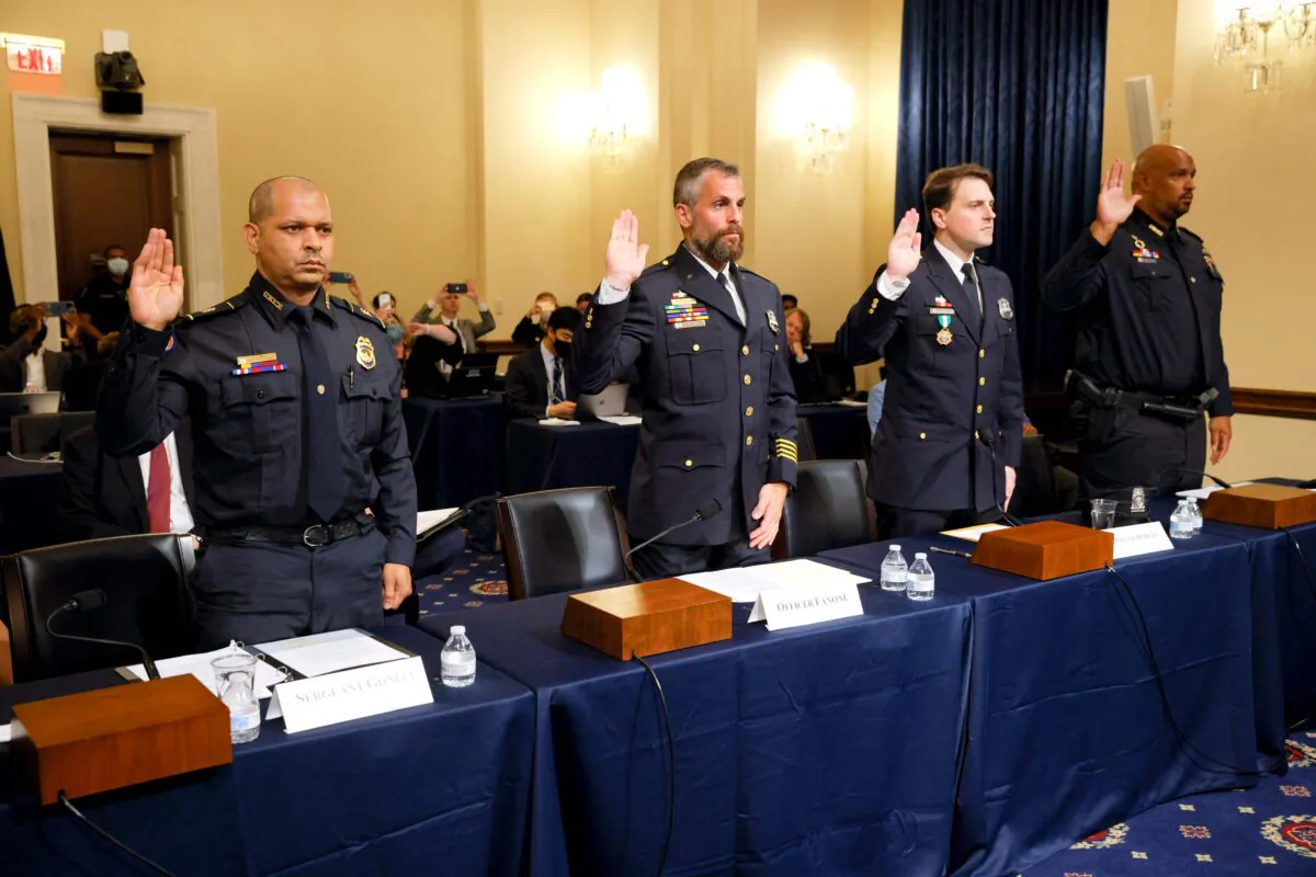 US Capitol Police and DC Metropolitan Police Department officers are sworn in before members of the Select Committee investigating Jan. 6, on July 27, 2021. (Jim Bourg/Pool/AFP via Getty Images)