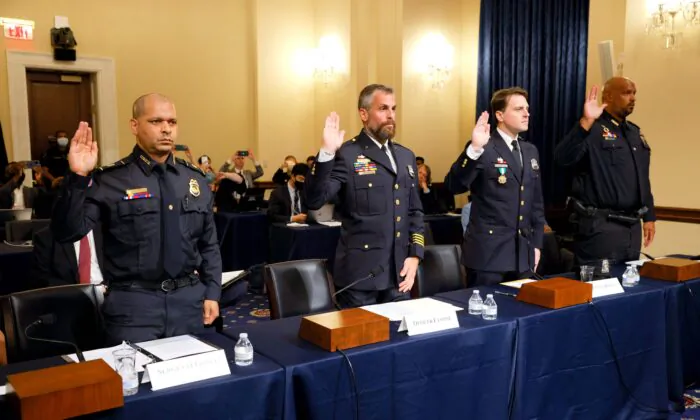 US Capitol Police and DC Metropolitan Police Department officers are sworn in before members of the Select Committee investigating Jan. 6, on July 27, 2021. (Jim Bourg/Pool/AFP via Getty Images)