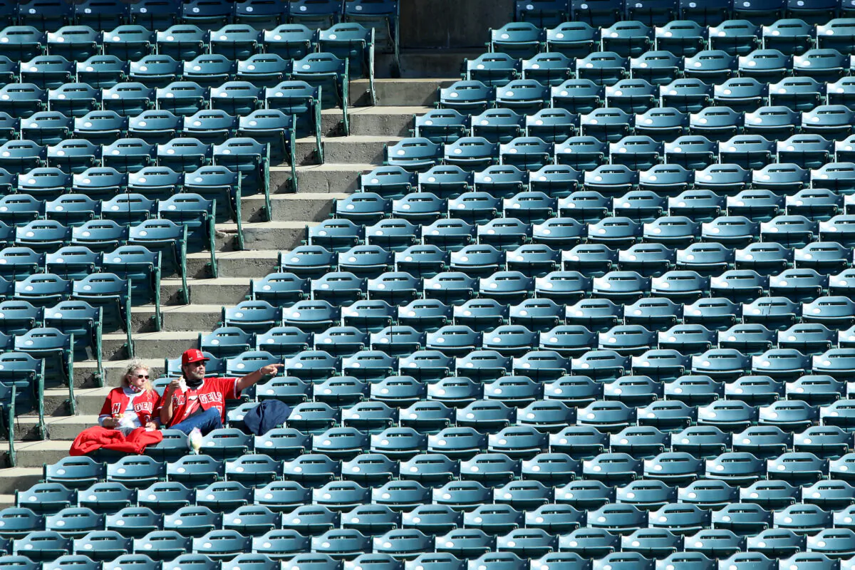 Fans look on during warm ups before the game between the Los Angeles Angels and the Cleveland Indians at Angel Stadium of Anaheim in Anaheim, Calif., on May 19, 2021. (Katelyn Mulcahy/Getty Images)