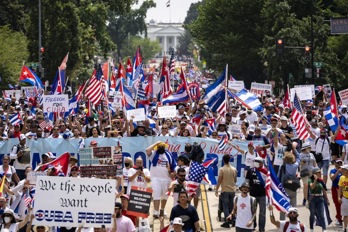 Cuban activists and supporters march from the White House to the Cuban Embassy on 16th Street during a Cuban freedom rally in Washington on July 26, 2021. (Drew Angerer/Getty Images)