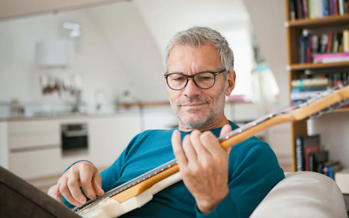 The "10,000-hour rule" was devised by Professor Anders Ericsson. It's the idea that it takes 10,000 hours of practice to become accomplished at something, whether it's playing a guitar or building a business.(WESTEND61/GETTYIMAGES)
