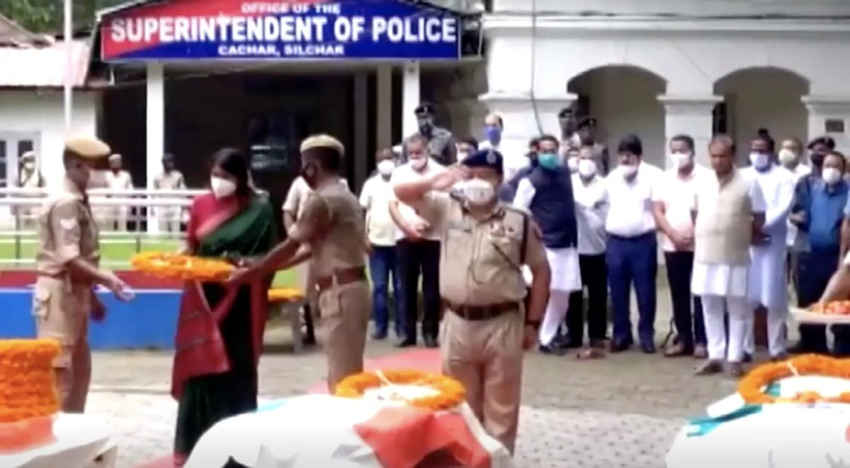 Police personnel pay tribute on July 27, 2021, to five officers who were killed during clashes with border state Mizoram in Assam state, India. (ANI via Reuters/Screenshot via NTD)