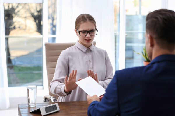 Woman,Refuses,To,Take,Bribe,Money,At,Wooden,Table