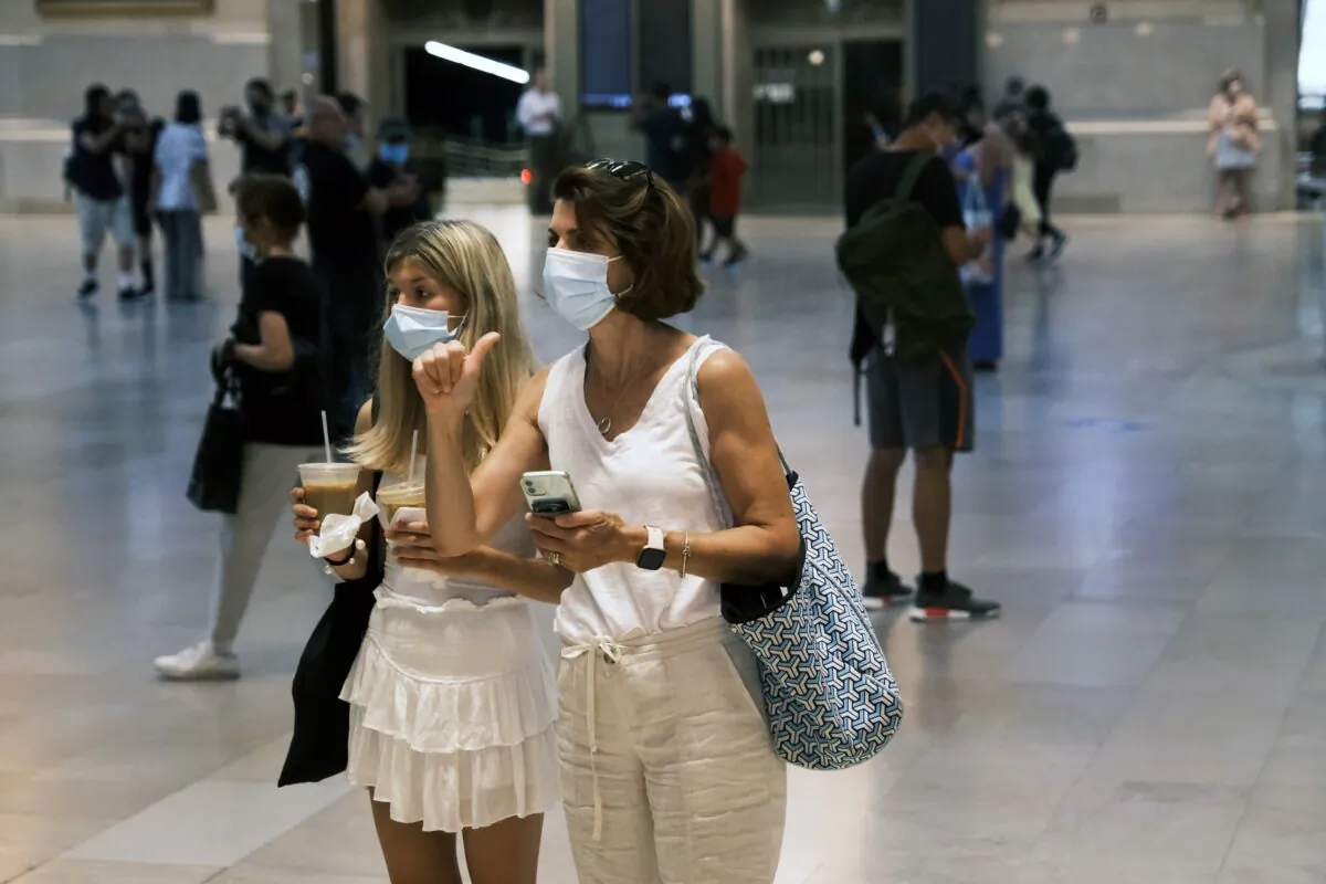 People wear masks while walking in Grand Central Terminal in New York City on July 27, 2021. (Spencer Platt/Getty Images)