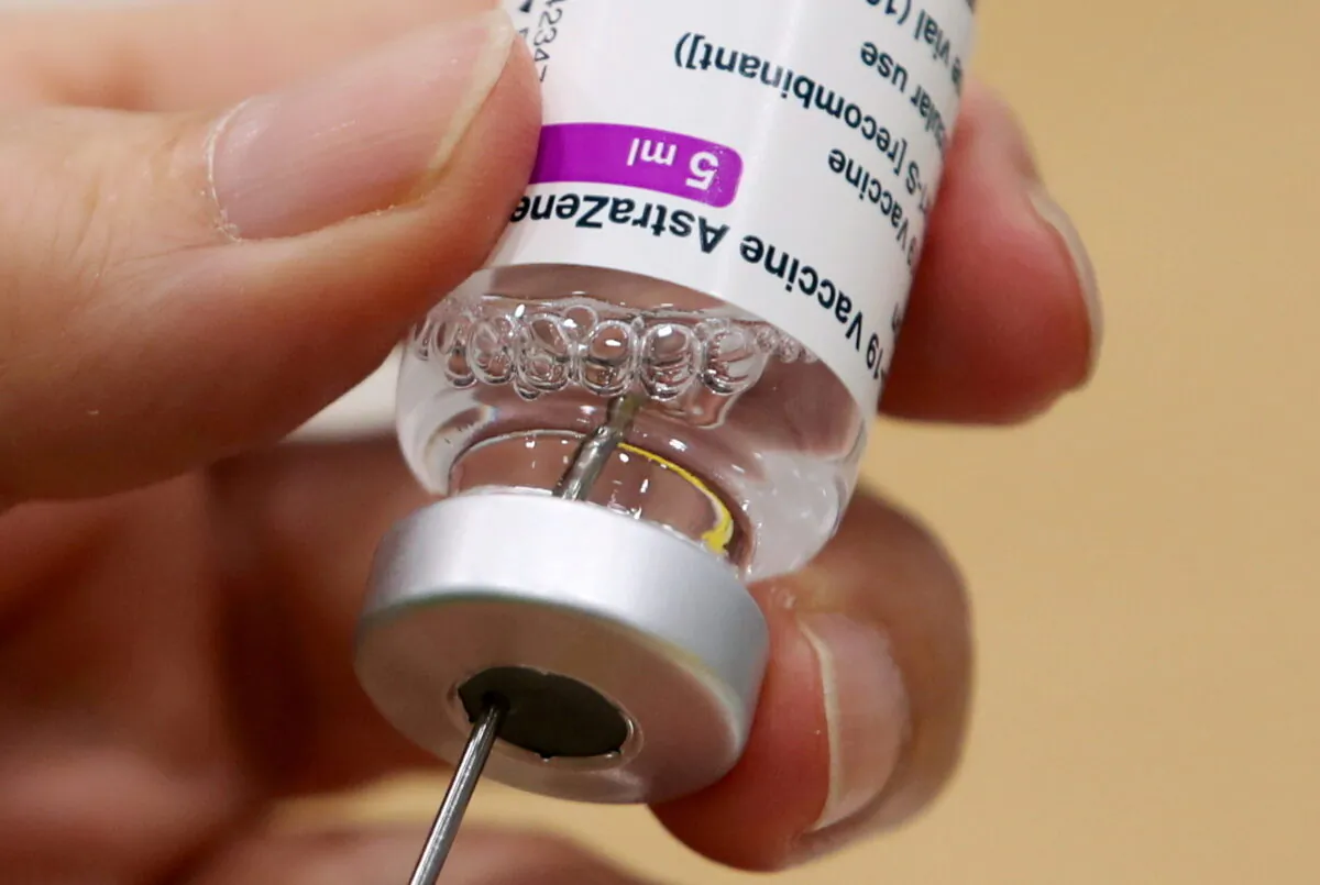 A medical worker prepares a dose of Oxford/AstraZeneca's COVID-19 vaccine at a vaccination centre in Antwerp, Belgium, on March 18, 2021. (Yves Herman/Reuters)