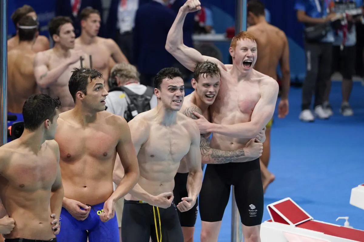 Britain celebrates after winning the mens' 4x200-meter freestyle relay at the 2020 Summer Olympics, in Tokyo, Japan, on July 28, 2021. (Charlie Riedel/AP Photo)