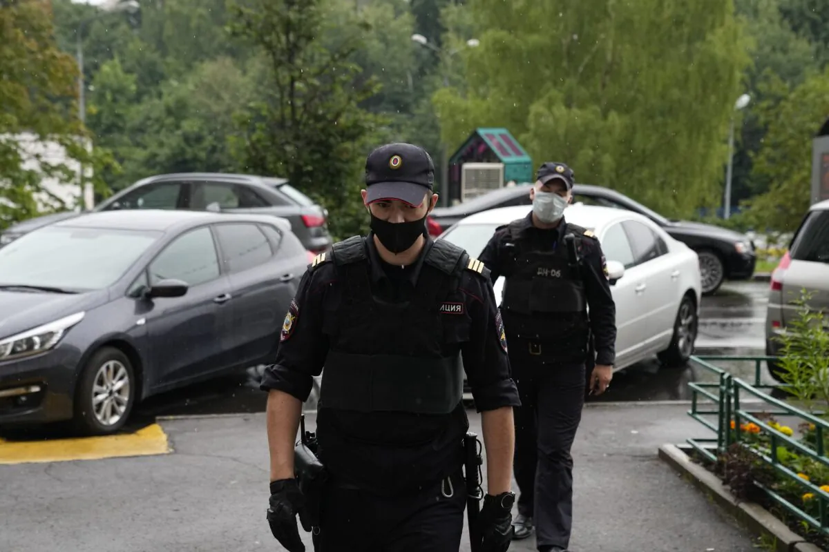 Police at the scene at the apartment block, where Roman Dobrokhotov, the chief editor of The Insider lives, in Moscow, Russia, on July 28, 2021. (Alexander Zemlianichenko/AP Photo)