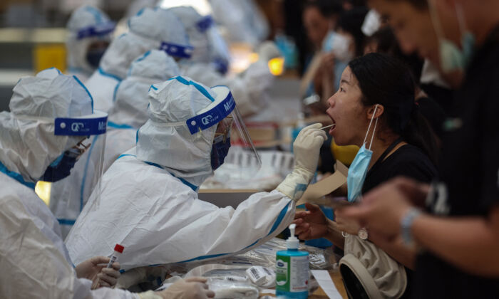 A resident receives nucleic acid test for the COVID-19 coronavirus in Nanjing, in eastern Jiangsu Province, on July 21, 2021. (STR/AFP via Getty Images)