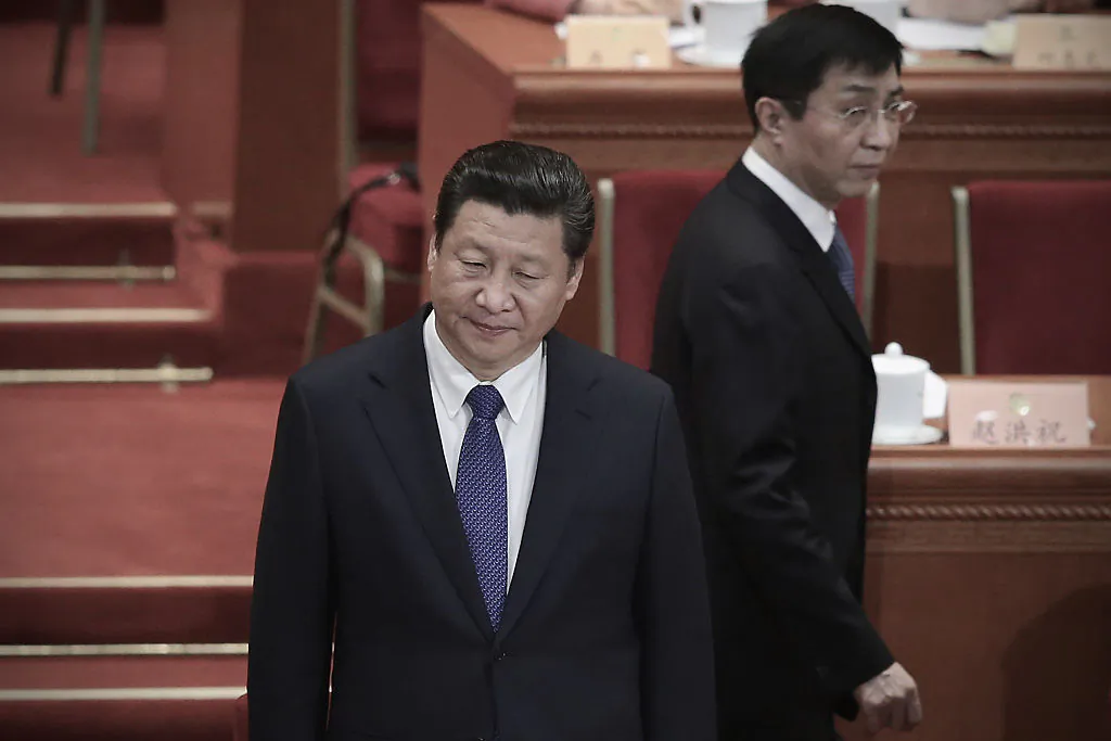 Chinese leader Xi Jinping (L) and member of the Political Bureau of the CPC Central Committee Wang Huning (R) arrive at the closing session of the Chinese People's Political Consultative Conference at the Great Hall of the People in Beijing, China, on March 13, 2015. (Feng Li/Getty Images)