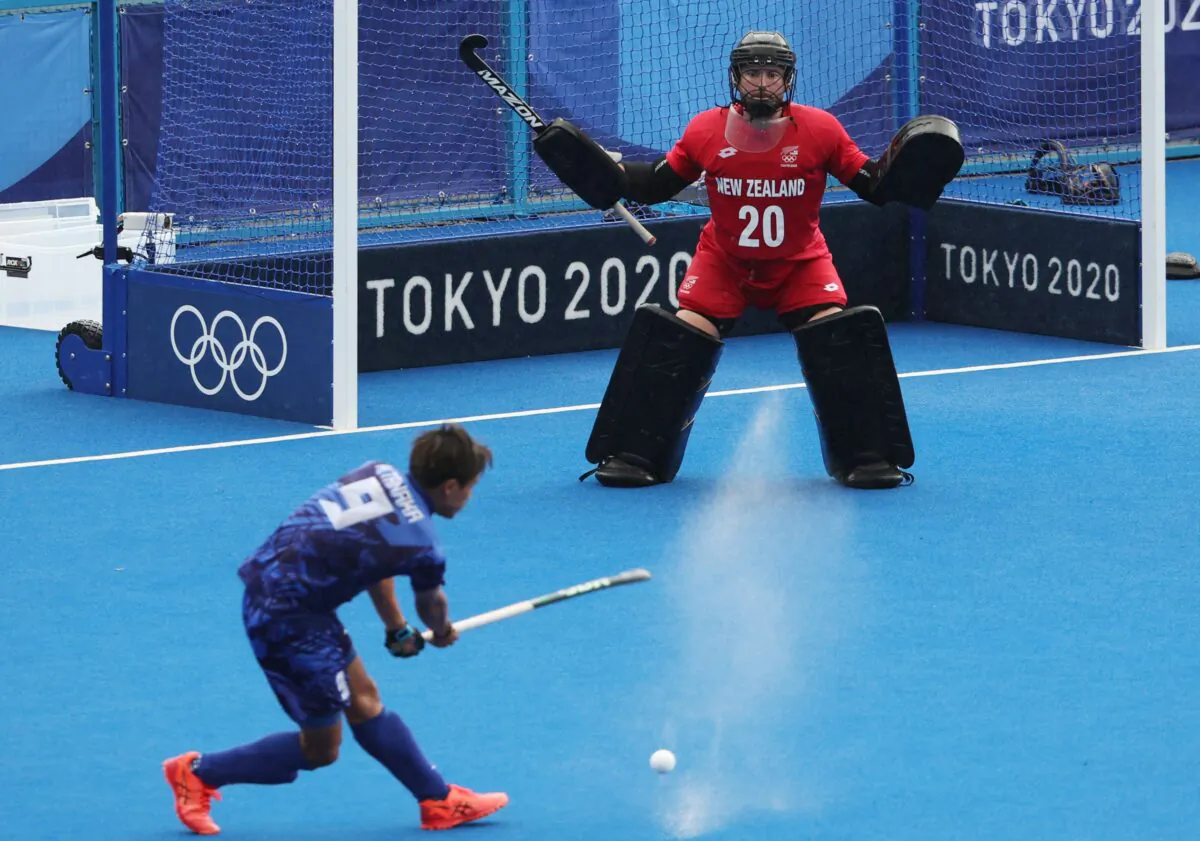 Leon Hayward of New Zealand defends against Kenta Tanaka of Japan during their men's pool A match of the Tokyo 2020 Olympic Games field hockey competition, at the Oi Hockey Stadium in Tokyo, Japan, on July 27, 2021. (Alkis Konstantinidis/Reuters)