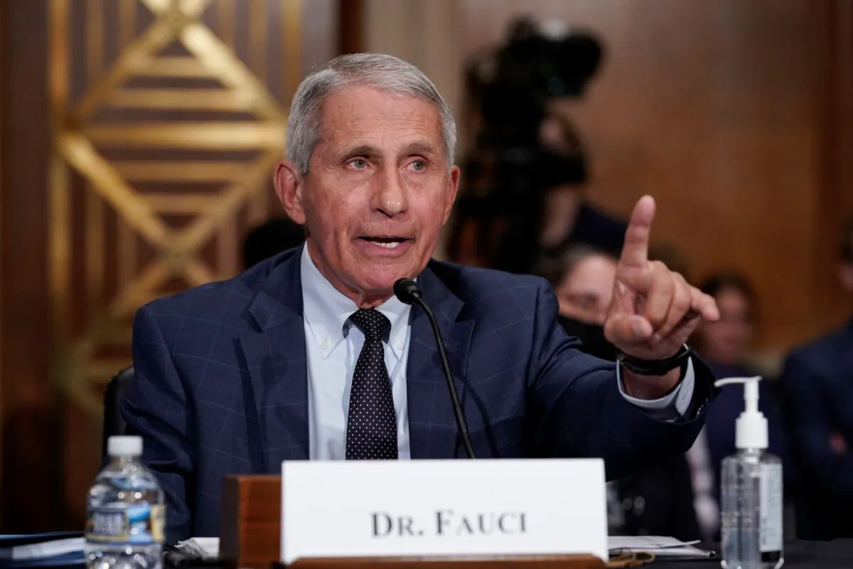 Top infectious disease expert Dr. Anthony Fauci responds to accusations by Sen. Rand Paul (R-Ky.) as he testifies before the Senate Health, Education, Labor, and Pensions Committee, on Capitol Hill in Washington, on July 20, 2021. (J. Scott Applewhite/Pool/AP Photo)