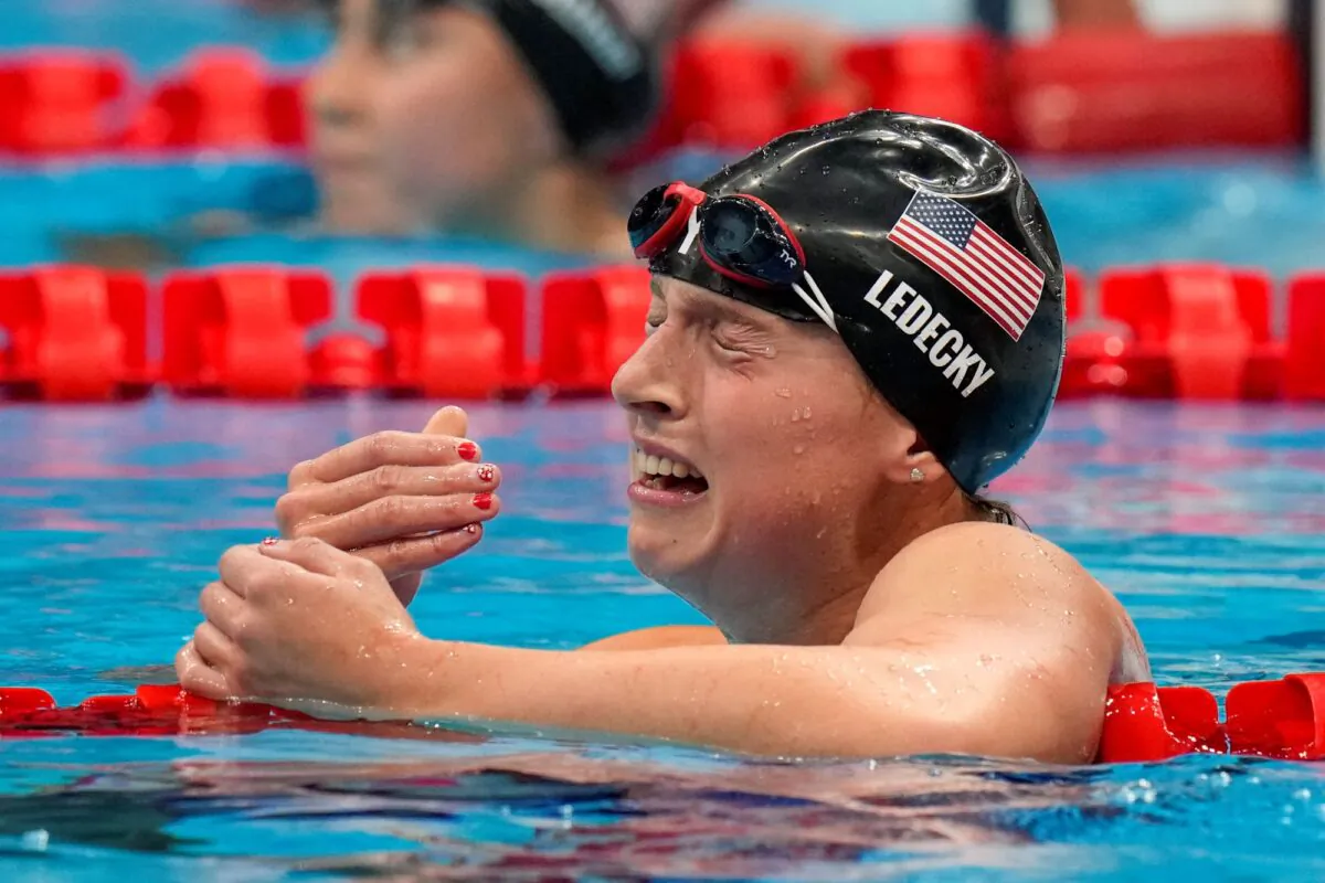 Katie Ledecky, of the United States, celebrates after winning the women's 1500-meters freestyle final at the 2020 Summer Olympics in Tokyo, Japan on July 28, 2021. (AP Photo/Petr David Josek)
