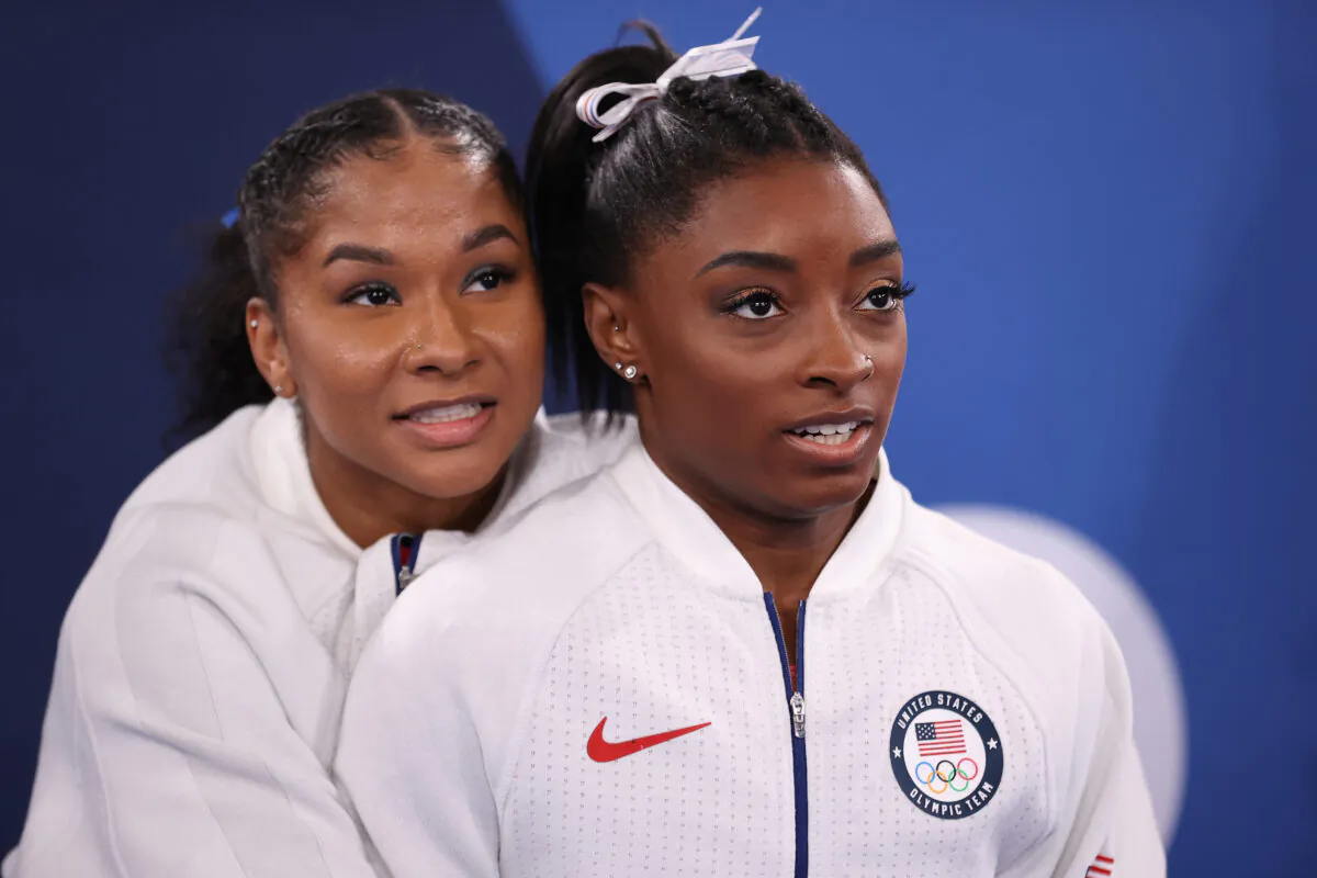 Jordan Chiles and Simone Biles (R) of Team United States react during the Women's Team Final on day four of the Tokyo 2020 Olympic Games at Ariake Gymnastics Centre in Tokyo, Japan, on July 27, 2021. (Laurence Griffiths/Getty Images)