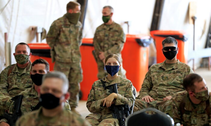 U.S. soldiers wearing face masks are seen during a handover ceremony of Taji military base north of Baghdad, Iraq, on Aug. 23, 2020. (Thaier Al-Sudani/Reuters)