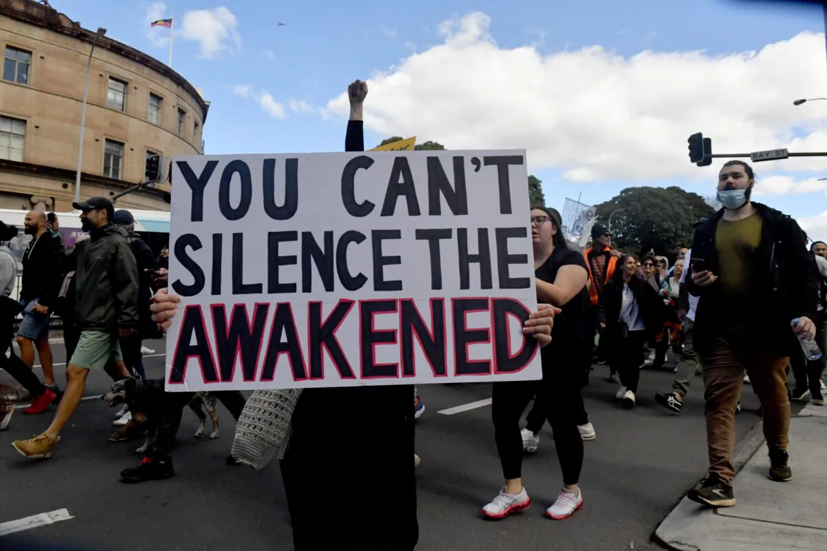 Protesters march along Broadway and George St towards Sydney Town Hall during the ‘World Wide Rally For Freedom’ anti-lockdown rally at Hyde Park in Sydney, Australia, on July 24, 2021. (Mick Tsikas/AAP Image)