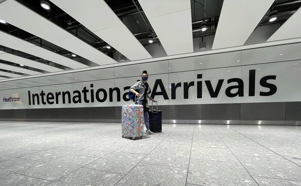 Travellers arrive at Heathrow Airport in London, on Jan. 17, 2021. (The Canadian Press/AP-Frank Augstein)