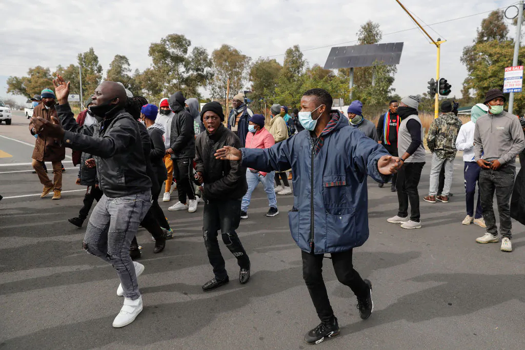 Soweto residents picket near the entrance to state entity Eskom Offices at Megawatt Park in Midrand, near Johannesburg, South Africa on June 9, 2021 due to the ongoing electricity disruptions. (Phill Magakoe/AFP via Getty Images)