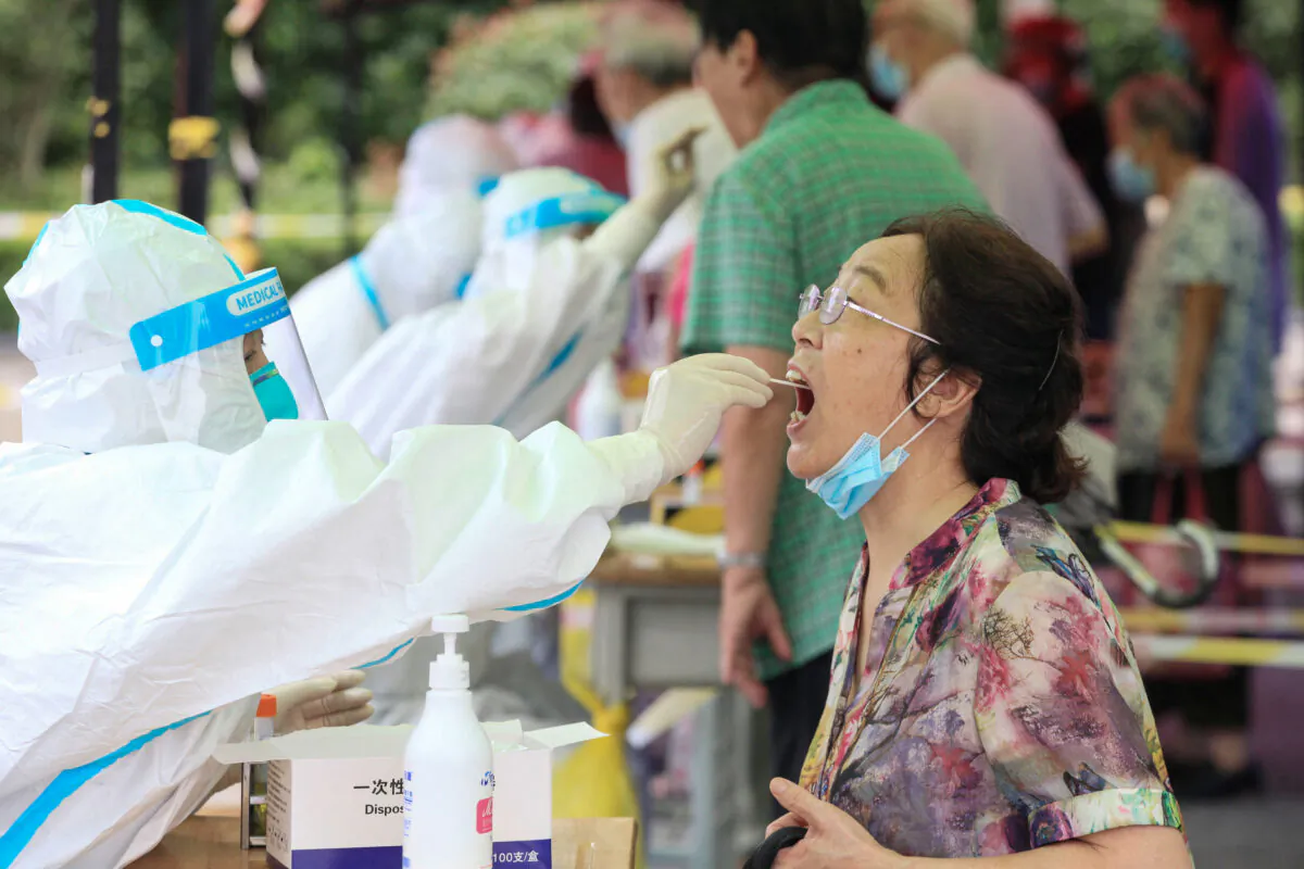 A woman receives a test for the COVID-19 in Nanjing, eastern China’s Jiangsu Province on July 29, 2021. (STR/AFP via Getty Images)