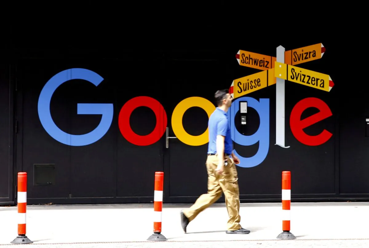 A man walks past a logo of Alphabet Inc.'s Google in front of at an office building in Zurich, Switzerland, on July 1, 2020. (Arnd Wiegmann/Reuters)