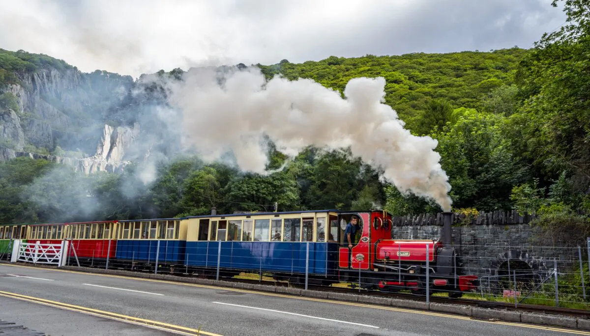 A steam train runs past the north-west Wales slate landscape, in Wales, on July 28, 2021. (Peter Byrne/PA)