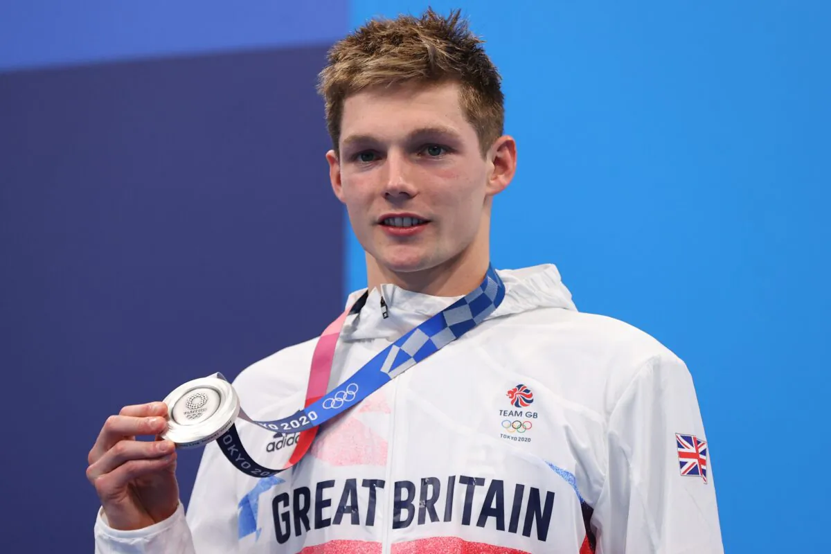 Duncan Scott of Britain poses on the podium with the silver medal of Men's 200-metre Individual Medley, at Tokyo 2020 Olympics, Tokyo, Japan, on July 30, 2021. (Marko Djurica/Reuters)