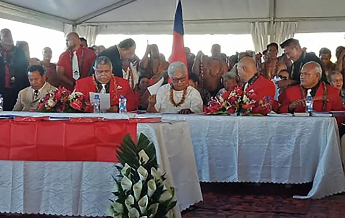 Fiame Naomi Mata'afa (seated C-in white) sits with members of parliament and the judiciary as she is sworn in as Samoa's first female prime minister in Apia on May 24, 2021. (Malietoa/AFP via Getty Images)