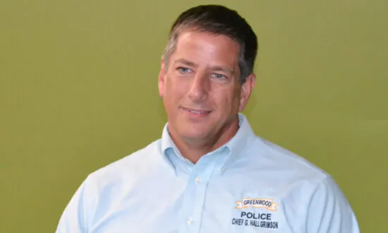 Ex-Police Chief Who Rescued Baby Pleads Guilty to Assault