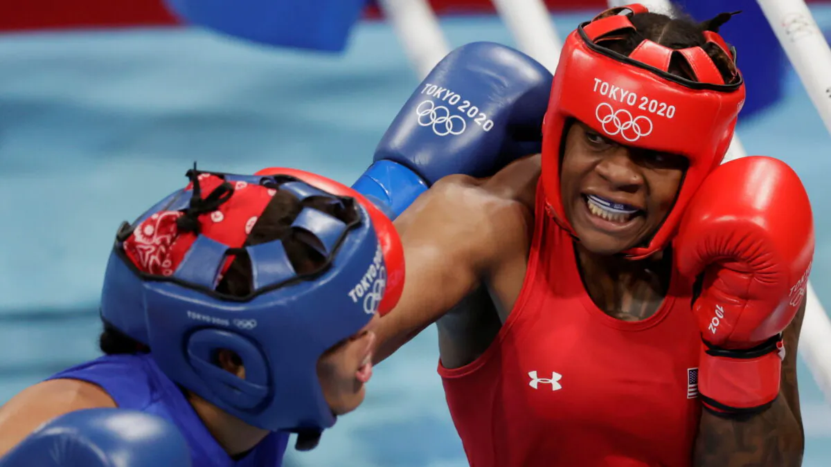Maria Moronta (L) of the Dominican Republic and Oshae Jones (R) of the United States in action during the Women's Welter (64-69kg) quarterfinal on day seven of the Tokyo 2020 Olympic Games at Kokugikan Arena in Tokyo, Japan, on July 30, 2021. (Ueslei Marcelino/Reuters)