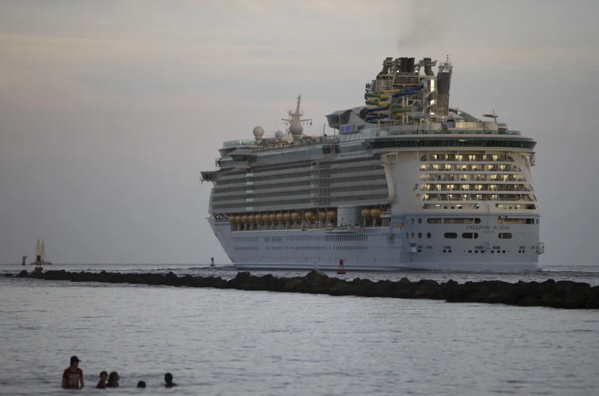 The Royal Caribbean Freedom of the Seas gets underway through the Government Cut shipping channel at Port Miami during the first U.S. trial cruise testing COVID-19 protocols in Miami, Fla., on June 20, 2021. (Joe Raedle/Getty Images)