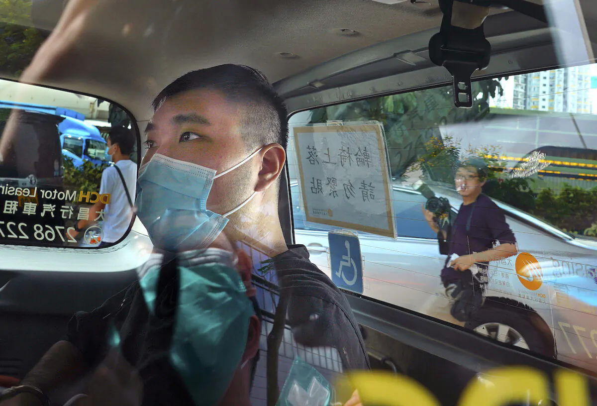 Tong Ying-kit arrives at a court in a police van in Hong Kong, on July 6, 2020. (AP Photo/Vincent Yu,File)