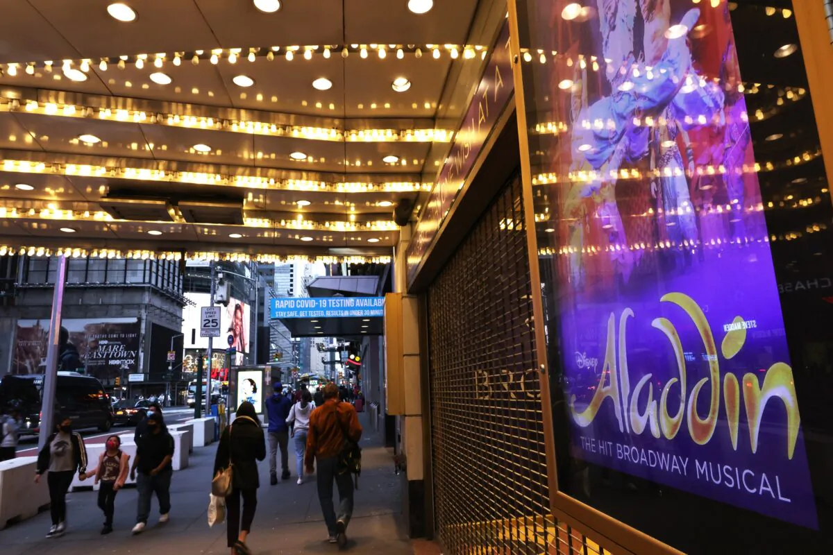 People walk through the Theater District in Manhattan, New York City, on May 6, 2021. (Michael M. Santiago/Getty Images)
