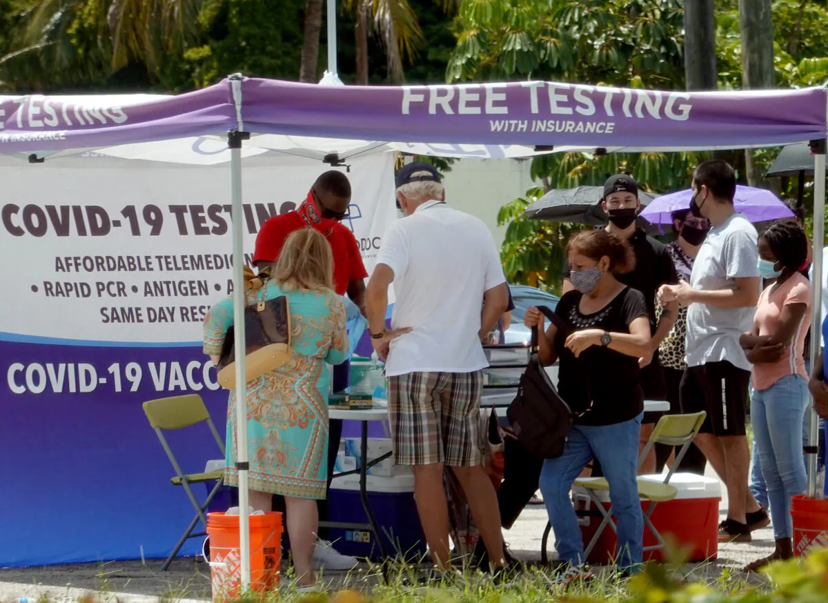People wait to receive a COVID-19 test at a pop-up testing location in Miami, Fla., on July 26, 2021. (Joe Raedle/Getty Images)