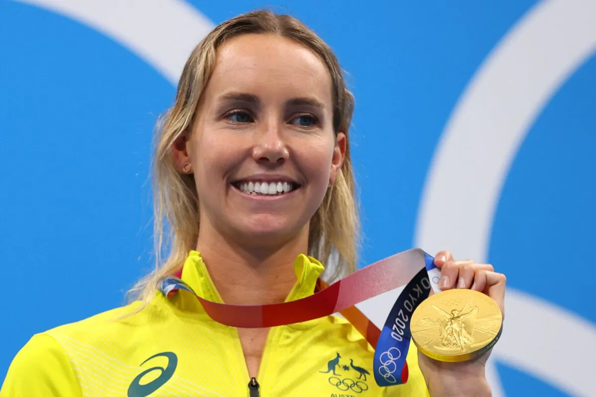 Emma McKeon of Australia poses on the podium with the gold medal after the final of the women's 100m freestyle swimming event during the Tokyo 2020 Olympic Games at the Tokyo Aquatics Centre in Tokyo, Japan, on July 30, 2021. (Marko Djurica/Reuters)