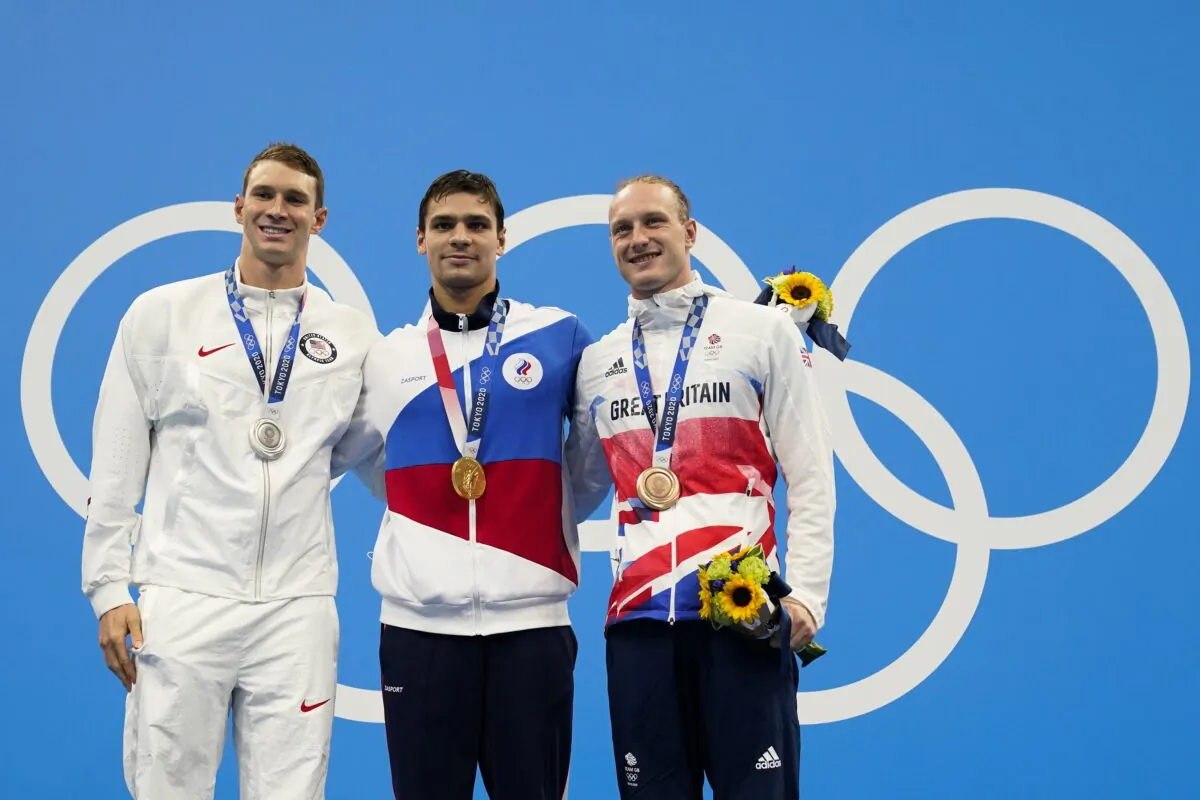 From left, Ryan Murphy, of United States, Evgeny Rylov, of Russian Olympic Committee, and Luke Greenbank, of Britain, pose with their medals after the men's 200-meter backstroke final at the 2020 Summer Olympics in Tokyo, Japan on July 30, 2021. (Gregory Bull/AP Photo)