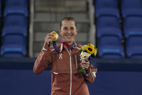 Belinda Bencic, of Switzerland, poses with the gold medal