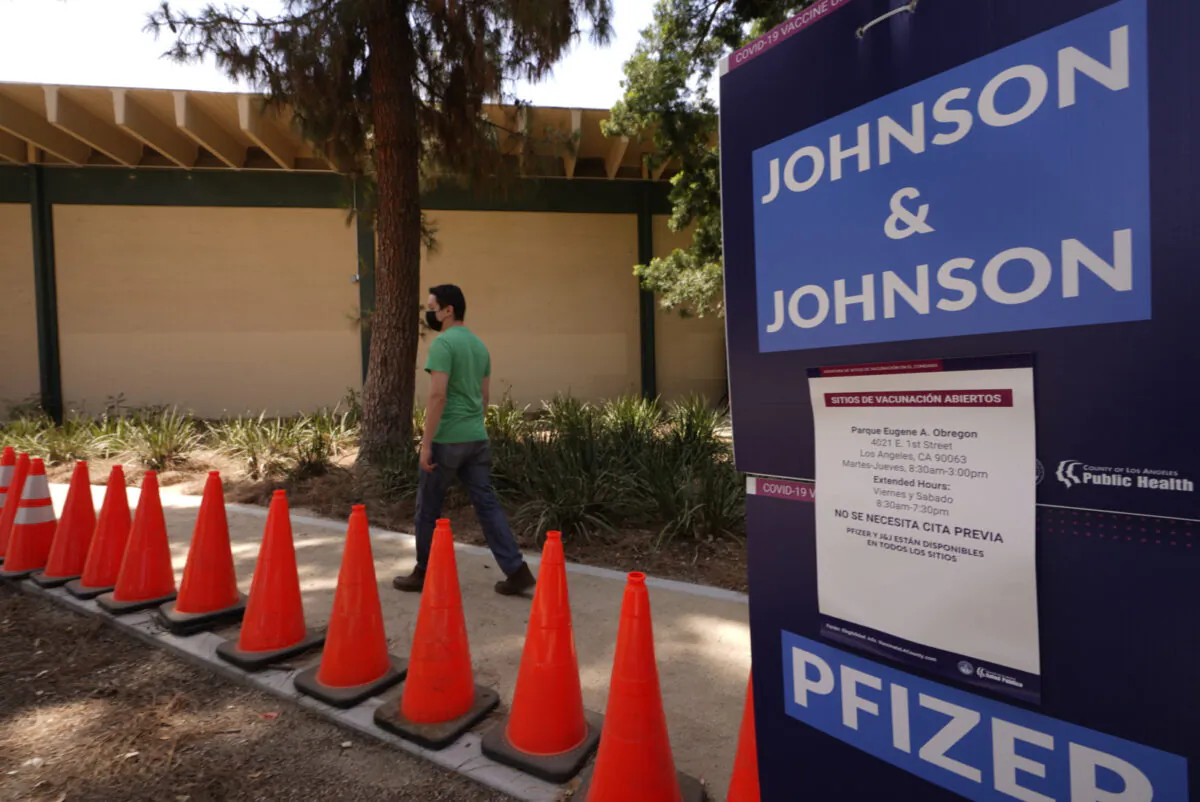 Banners advertise the availability of the Johnson & Johnson and Pfizer COVID-19 vaccines at a vaccination site in Los Angeles, Calif., on July 22, 2021. (Damian Dovarganes/AP Photo)