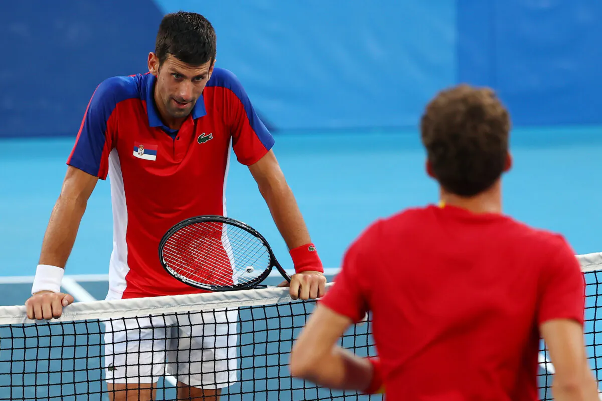 Novak Djokovic of Serbia reacts after losing his 2020 Olympics bronze medal men's tennis singles match against Pablo Carreno of Spain at the Ariake Tennis Park Centre in Tokyo, Japan, on July 31, 2021. (Mike Segar/Reuters)