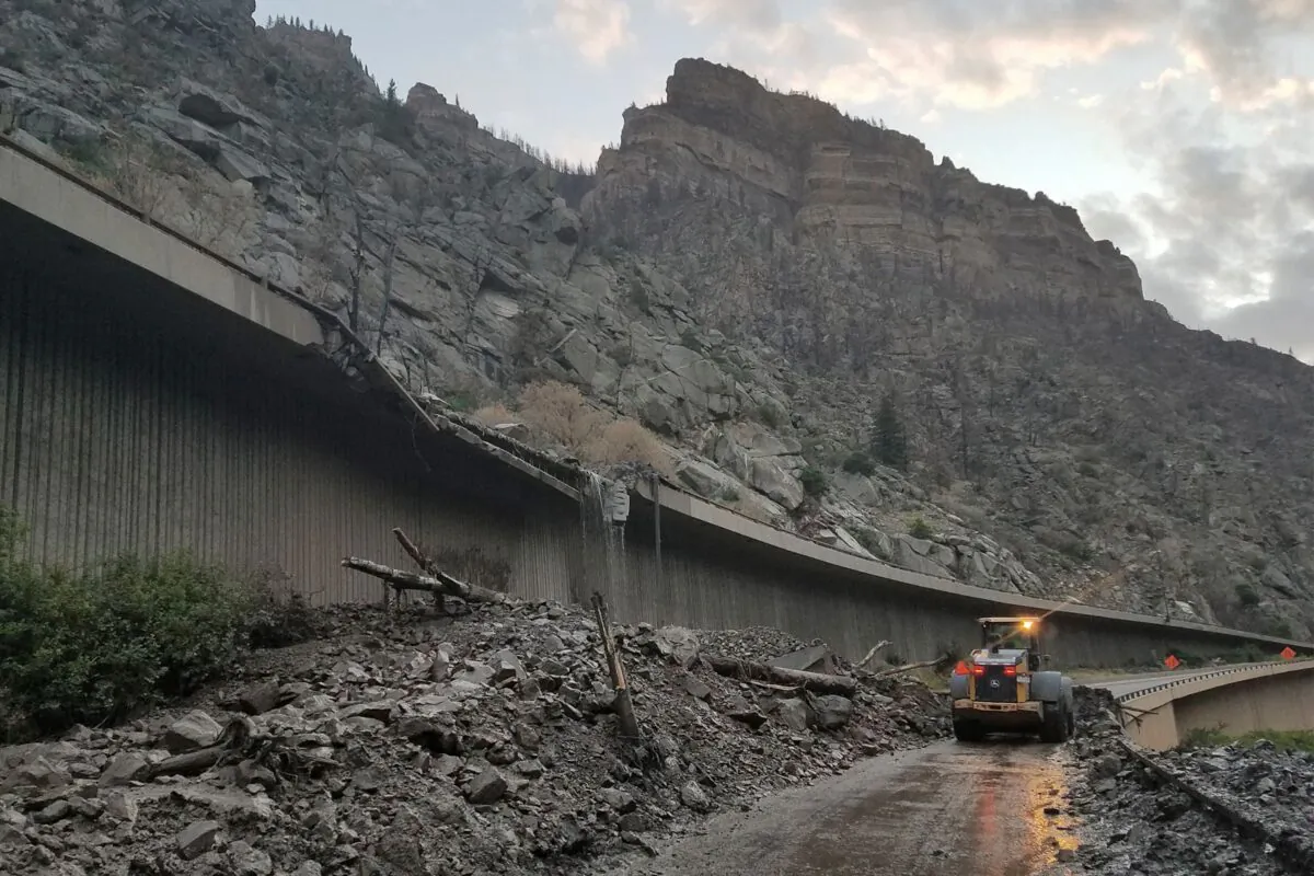 Equipment works to clear mud and debris from a mudslide on Interstate-70 through Glenwood Canyon, Colo., on July 30, 2021. (Colorado Department of Transportation via AP)