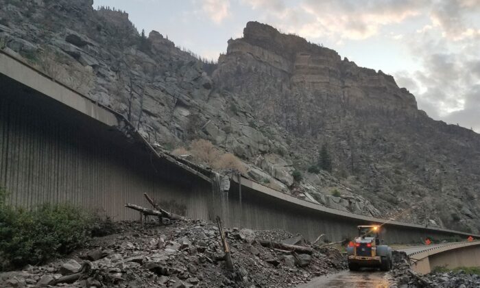 Equipment works to clear mud and debris from a mudslide on Interstate-70 through Glenwood Canyon, Colo., on July 30, 2021. (Colorado Department of Transportation via AP)
