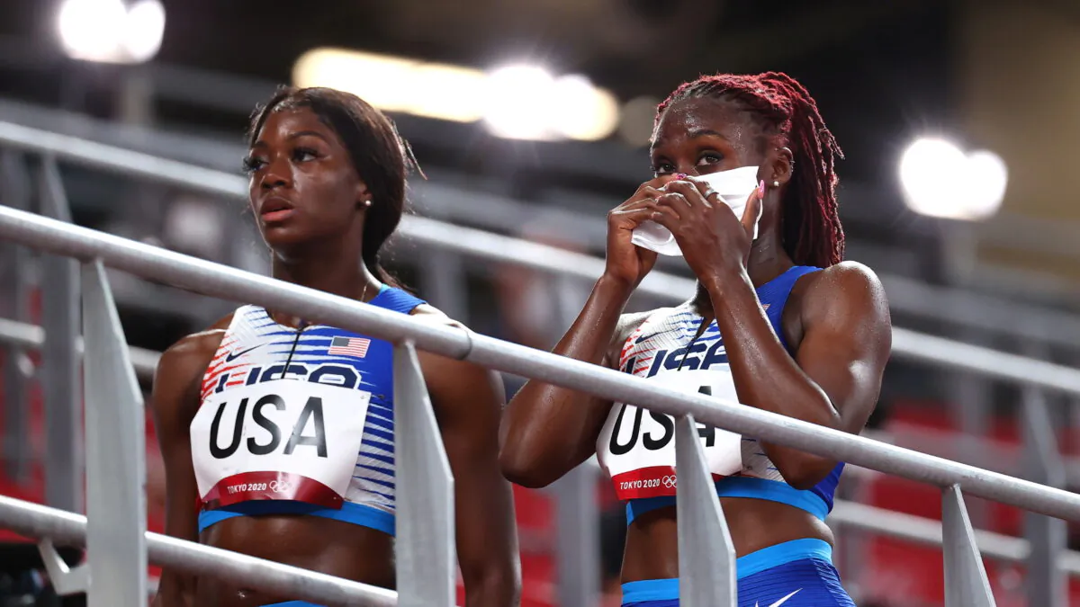 Lynna Irby and Taylor Manson of the United States react after competing in the mixed 4x400m relay heats during the Tokyo 2020 Olympic Games at the Olympic Stadium in Tokyo, Japan, on July 30, 2021. (Lucy Nicholson/Reuters)