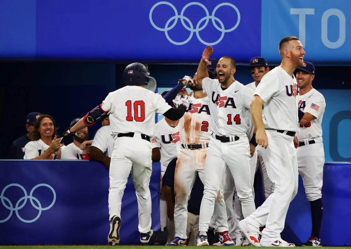 Nick Allen of the United States celebrates a home run with team mates in the Tokyo 2020 Olympics South Korea v United States baseball game in Yokohama Baseball Stadium, Yokohama, Japan on July 31, 2021. (Jorge Silva/Reuters)