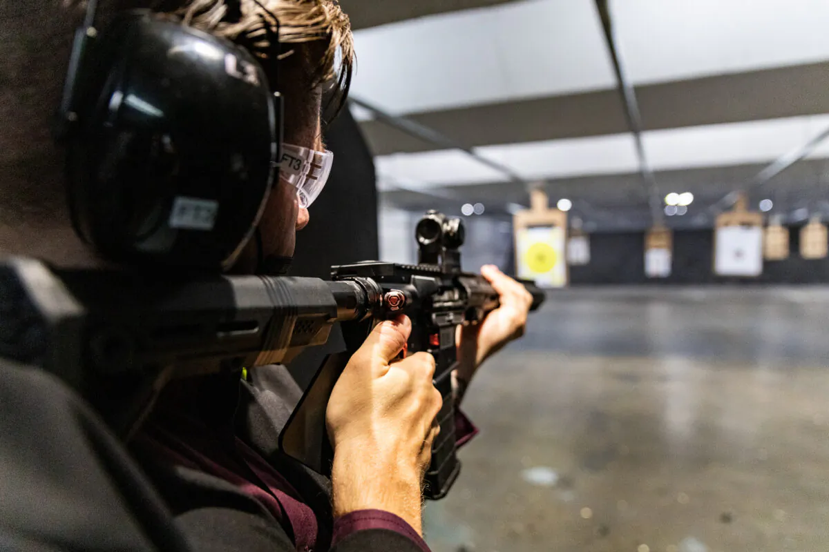 A man fires a rifle at a shooting range in Stanton, Calif., on May 3, 2021. (John Fredricks/The Epoch Times)