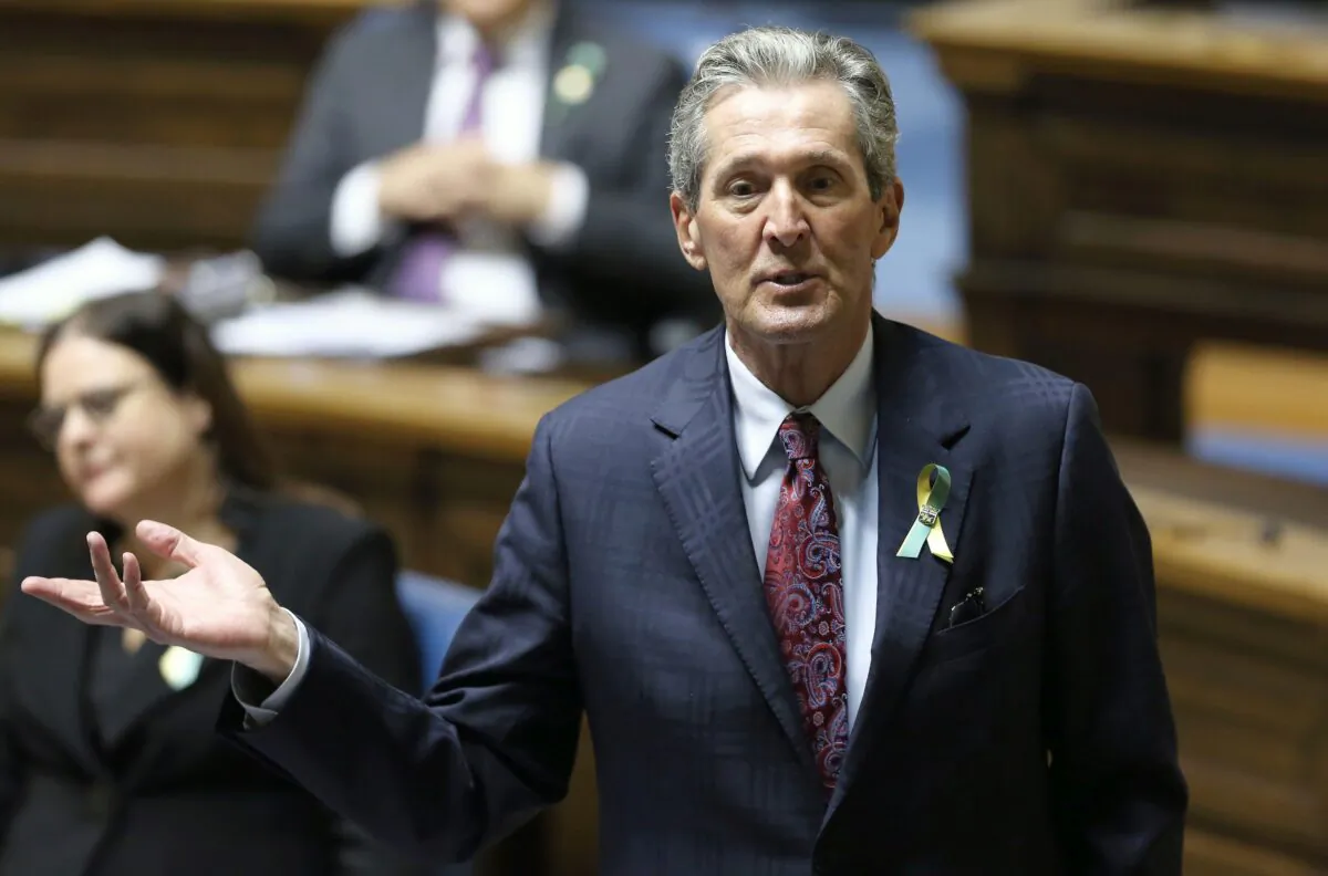 Premier Brian Pallister rises during question period in the Manitoba legislature on April 7, 2021. Pallister was accused of racism for his comments in early July on the toppling of two statues in Winnipeg on Canada Day. (The Canadian Press/Kevin King – POOL)