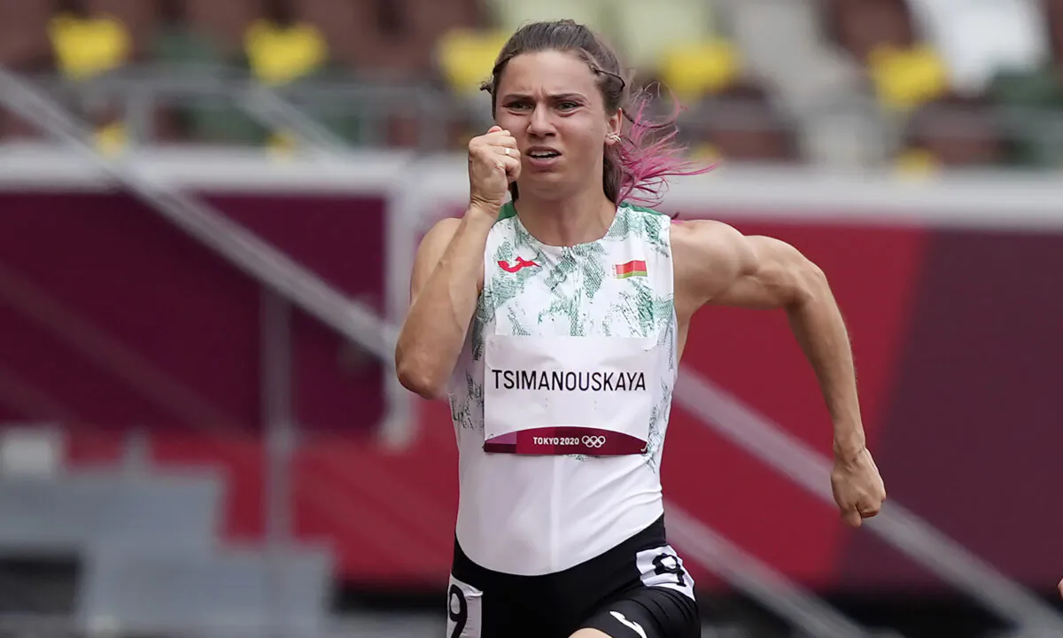 Krystsina Tsimanouskaya of Belarus runs in the women's 100-meter run at the 2020 Summer Olympics in Tokyo, Japan, on July 30, 2021. (Martin Meissner/AP Photo)