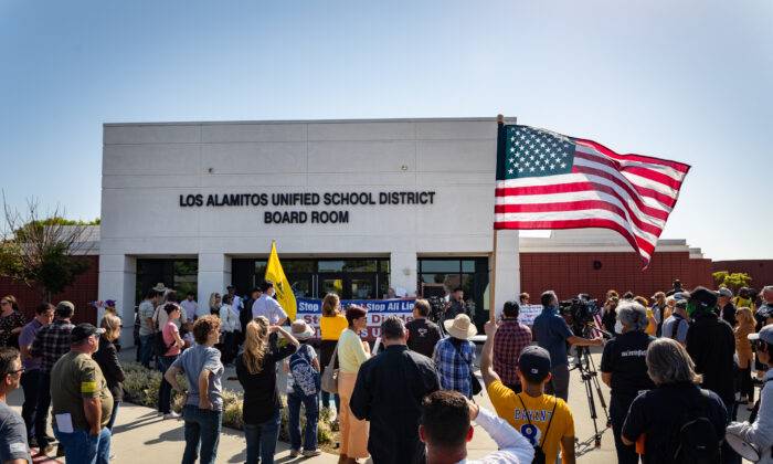 Demonstrators gather in front of Los Alamitos Unified School District Headquarters in protest of critical race theory teachings in Los Alamitos, Calif., on May 11, 2021. (John Fredricks/The Epoch Times)