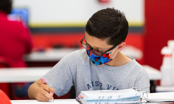 A student works on a math assignment in Laguna Niguel, Calif., on May 12, 2021. (John Fredricks/The Epoch Times)