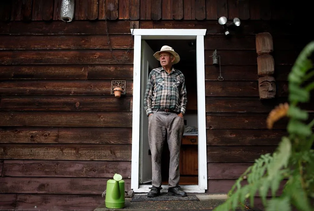 Sahtlam Tree Farm owner Robert Russell in front of his cabin in the Cowichan Valley area of Duncan, B.C., on July 31, 2021. (Chad Hipolito/The Canadian Press)  