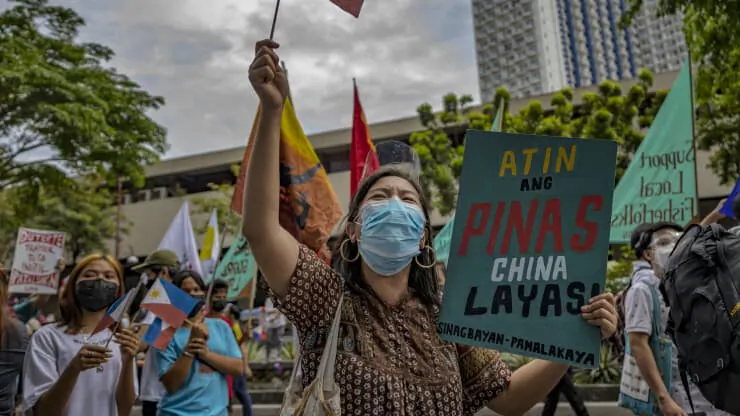 Filipinos march as they mark Independence Day with a protest against continued Chinese intrusions in Philippine waters, outside the Chinese Embassy in Makati, Metro Manila, Philippines, on June 12, 2021. (Ezra Acayan/Getty Images)