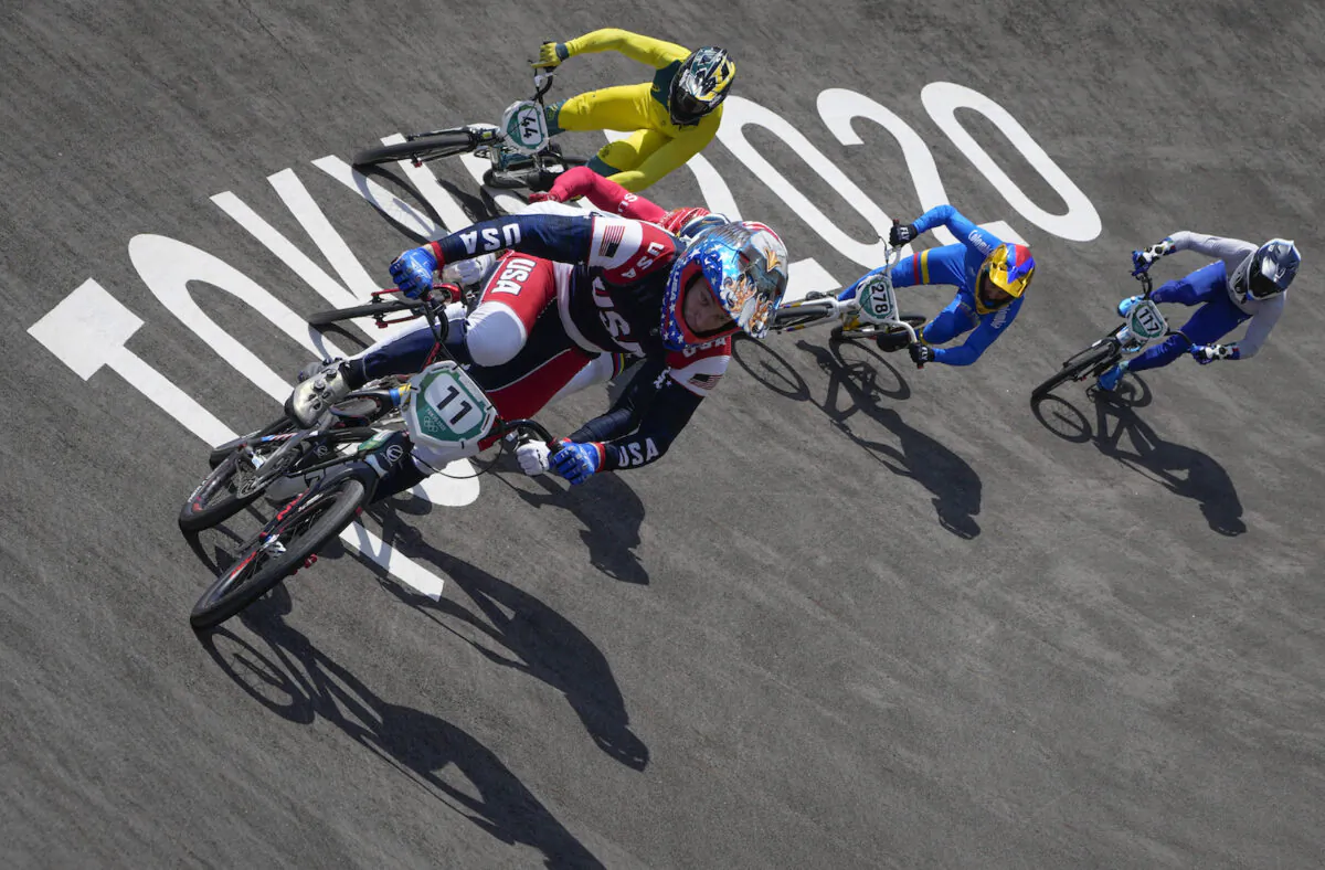 Connor Fields of the United States, (C), leads in the men's BMX Racing quarterfinals at the 2020 Summer Olympics, on July 29, 2021, in Tokyo, Japan. (Ben Curtis/AP Photo)