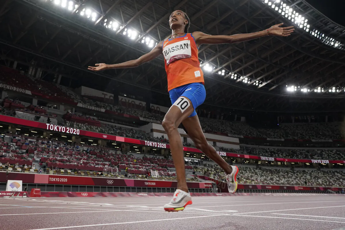 Sifan Hassan of the Netherlands celebrates as she crosses the finish line to win the women's 5,000-meters final at the 2020 Summer Olympics in Tokyo, Japan, on Aug. 2, 2021. (David J. Phillip/AP Photo)